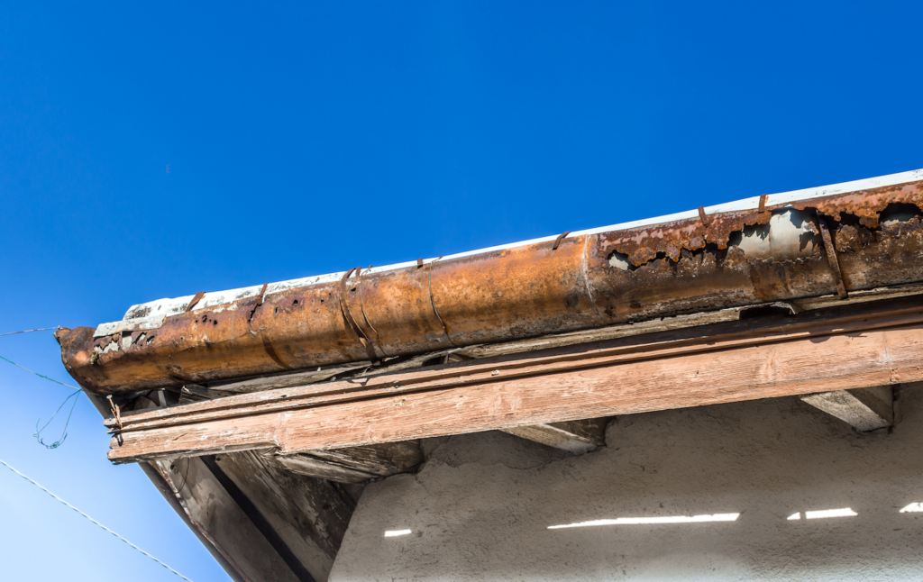 signs of roof leak in attic rusted gutters