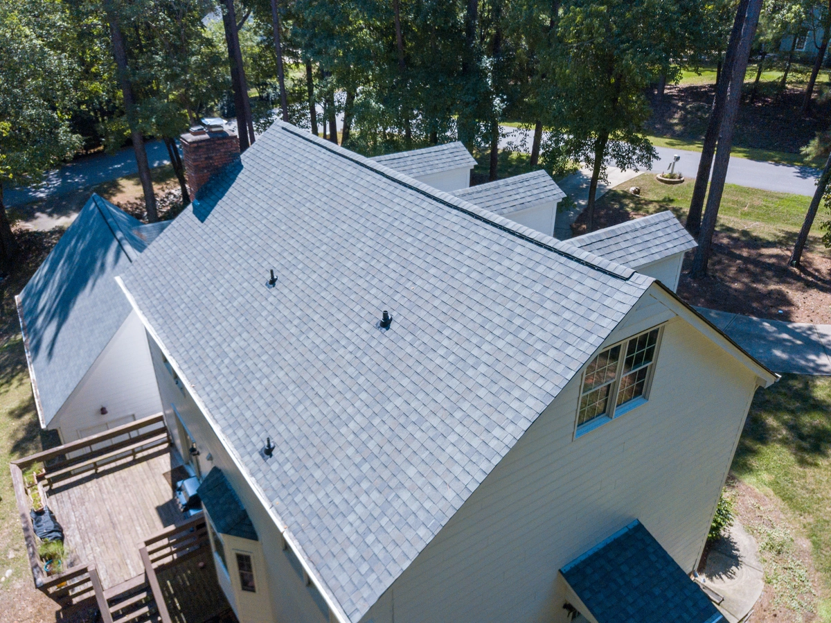 top view of a home with a new asphalt shingle installation