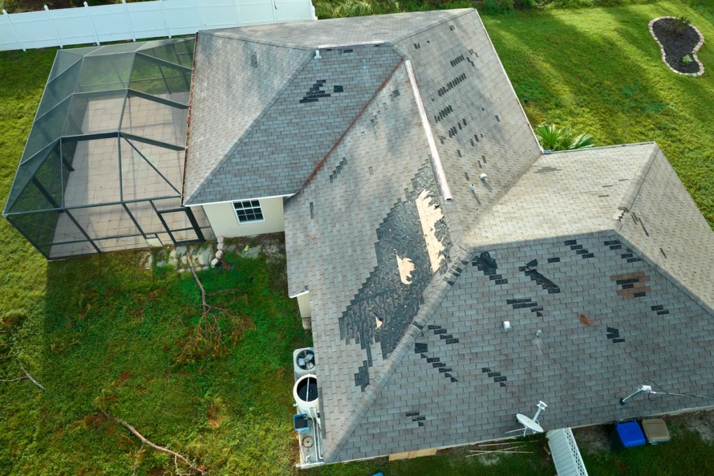 roof with missing and damaged shingles