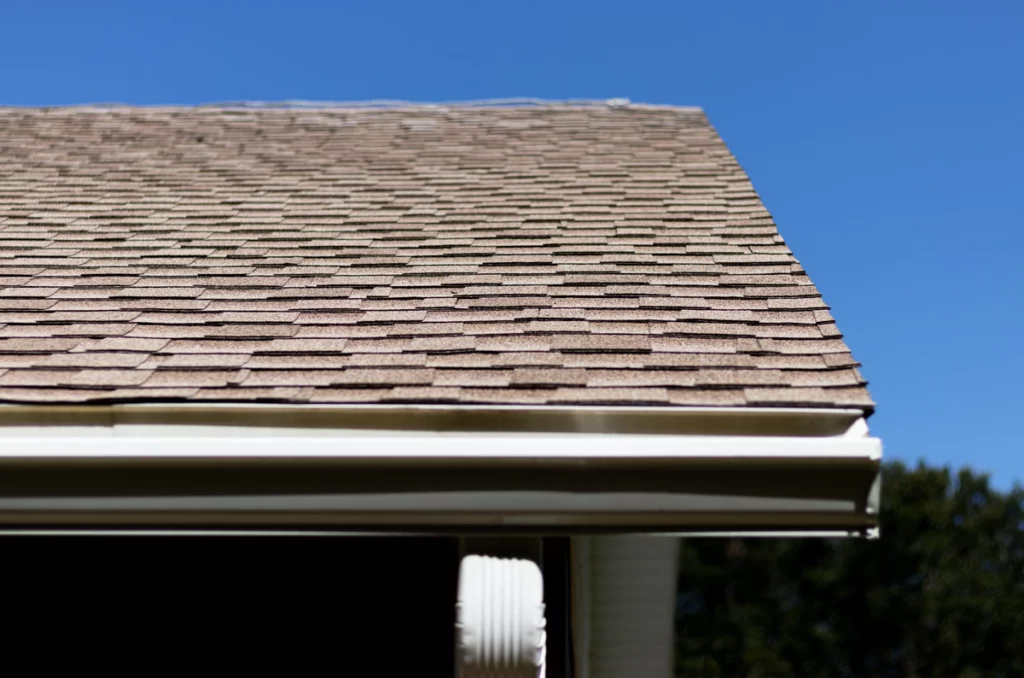 corner of the house roof with aged shingles