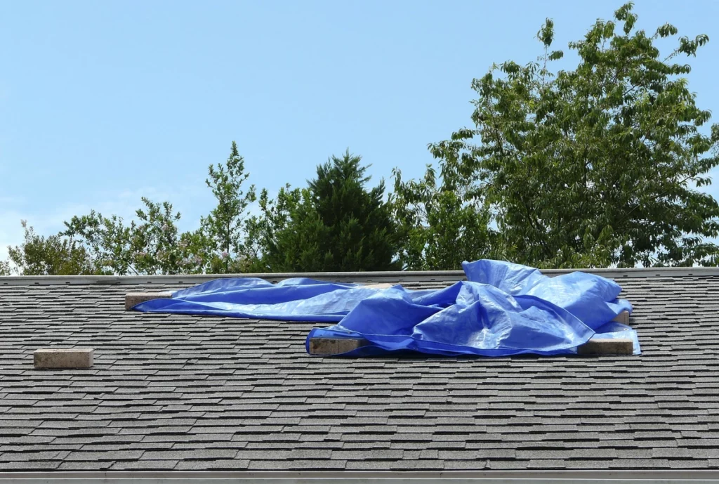 placing the tarp on roof