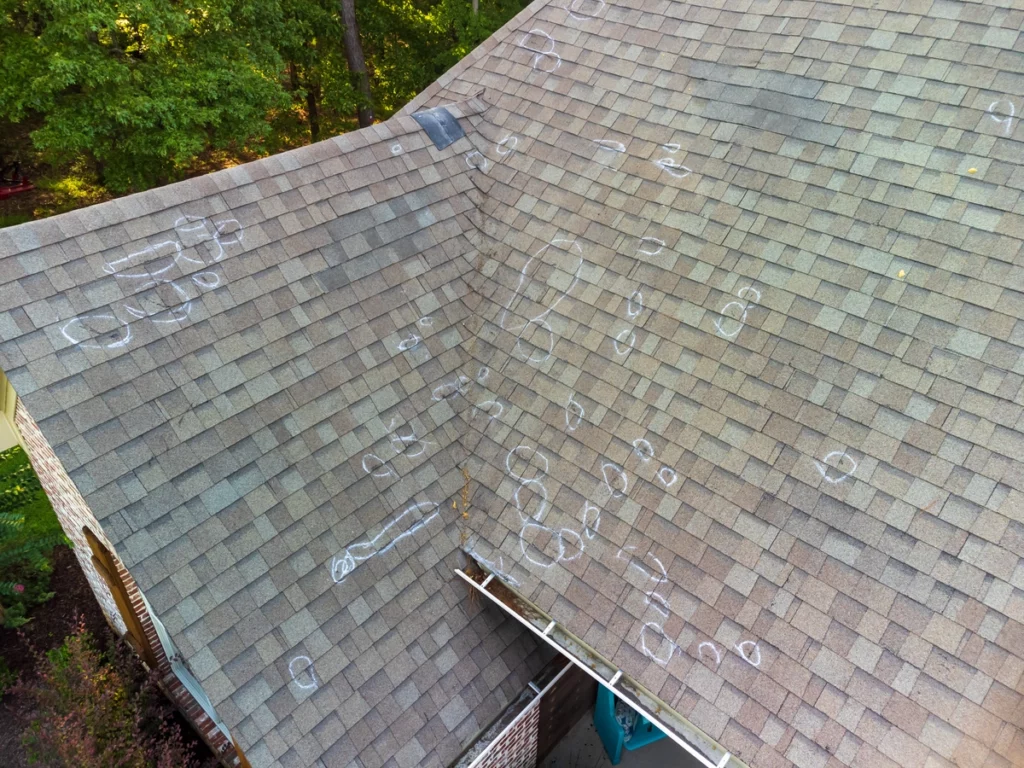 aerial view of shingle roof hail damage photo for storm damage insurance claims