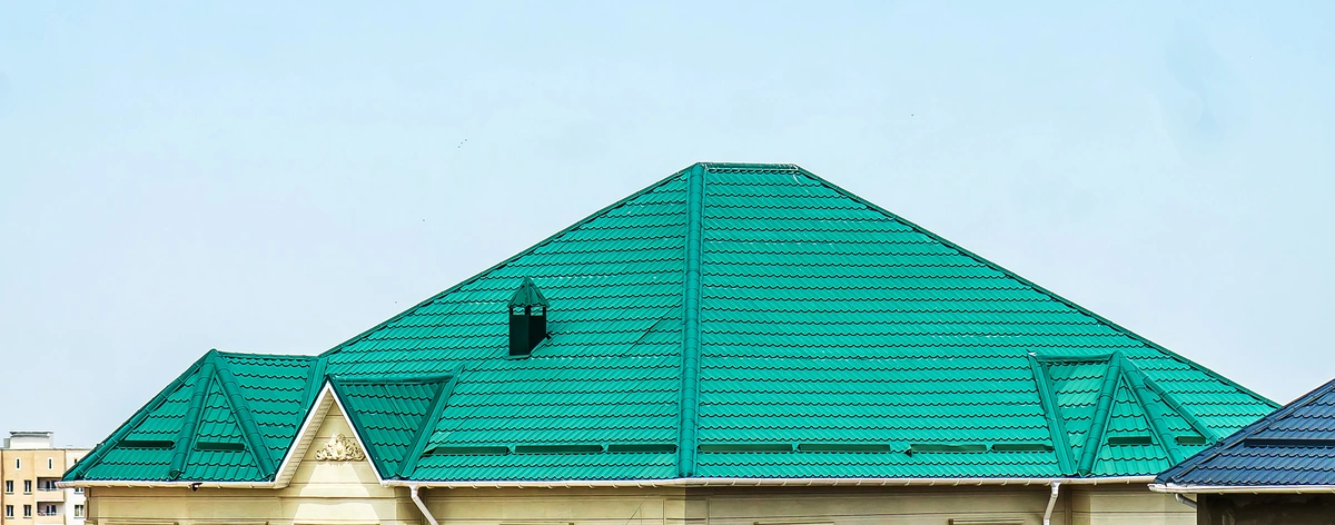 green metal roof against sky
