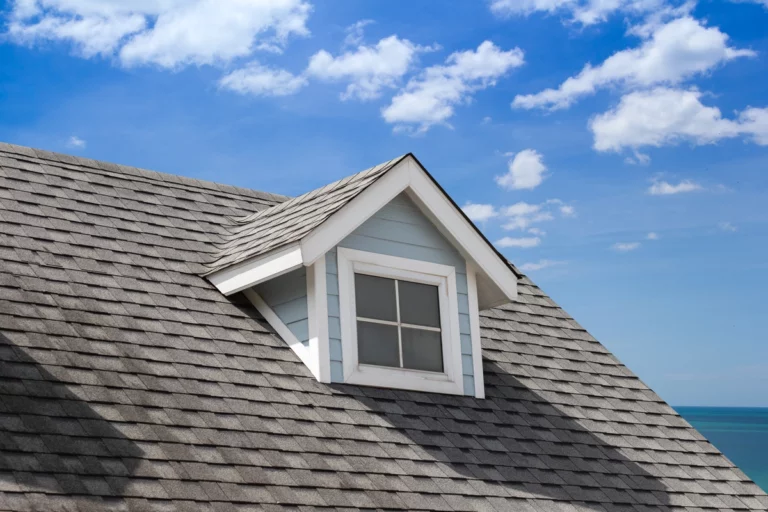 close up to asphalt shingle roof and dormer