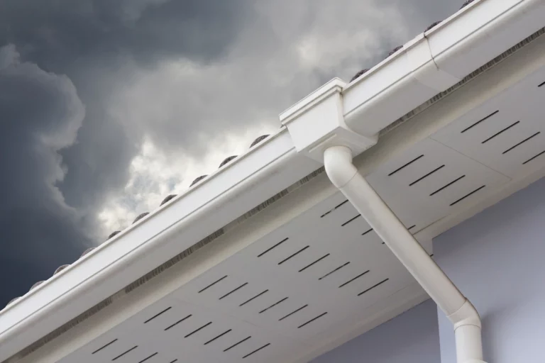 seamless gutters under a stormy sky