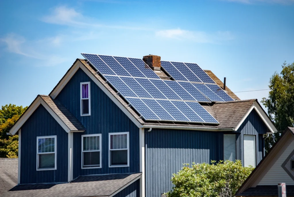 blue house with solar panels