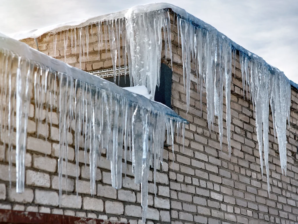 Icicles on a brick house