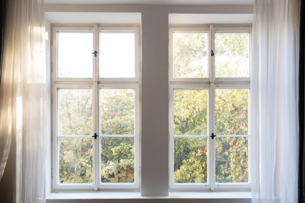 white windows with sunshine pouring through