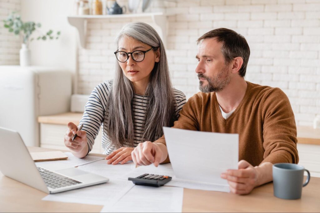 two person sitting with a laptop