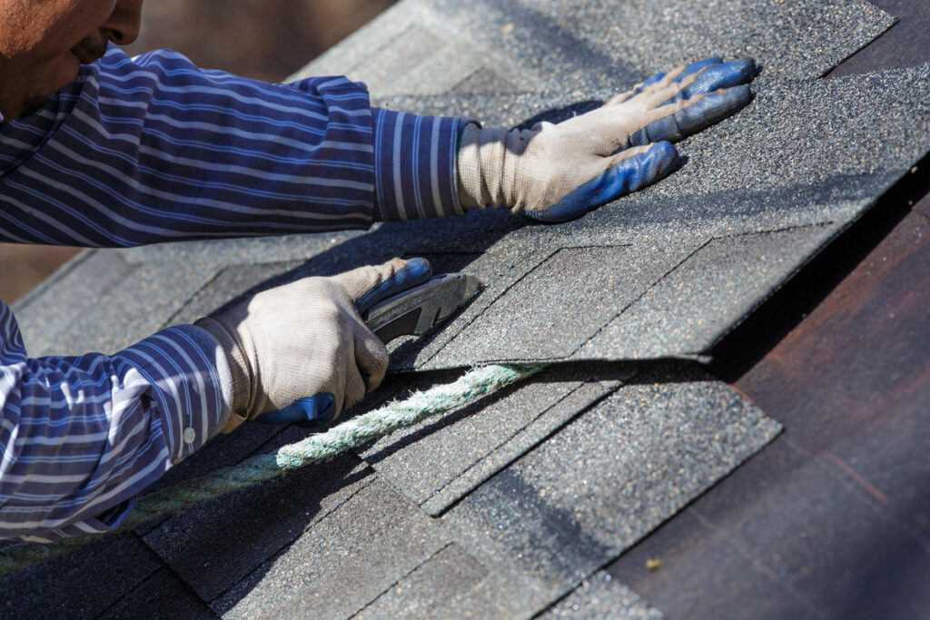 installing roof shingles closeview