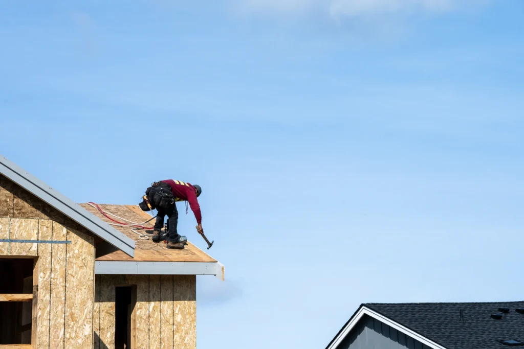 roofer installing sheathing