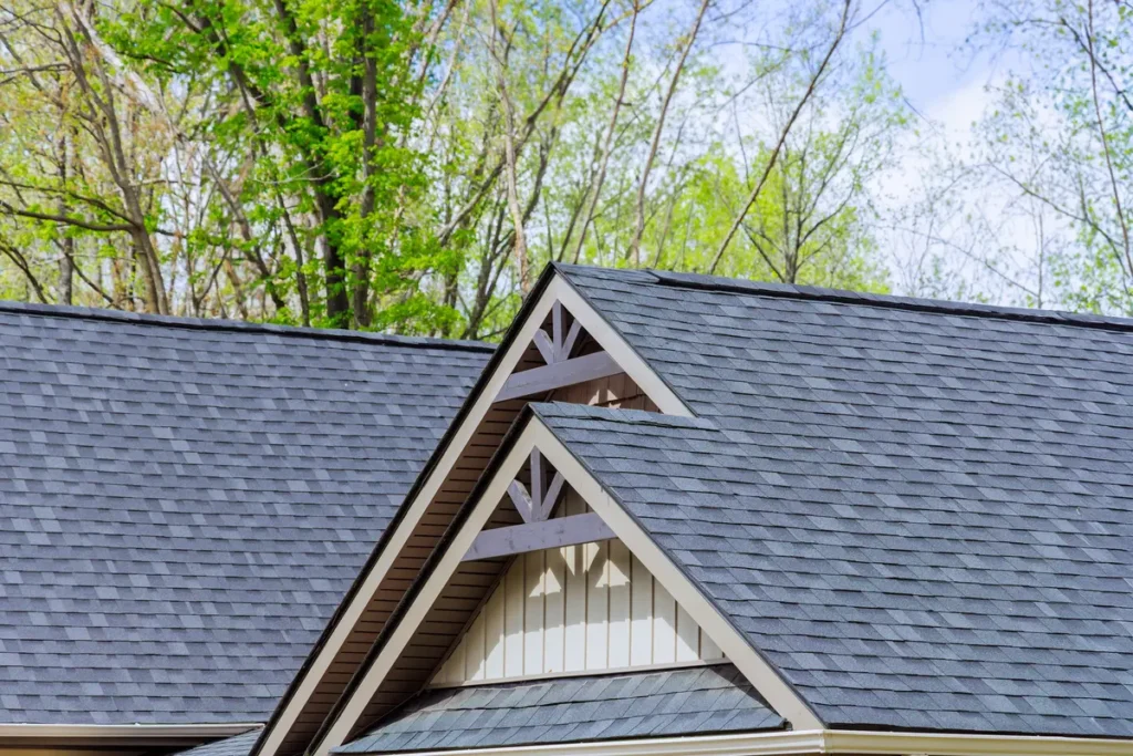 a shingle roof and trees