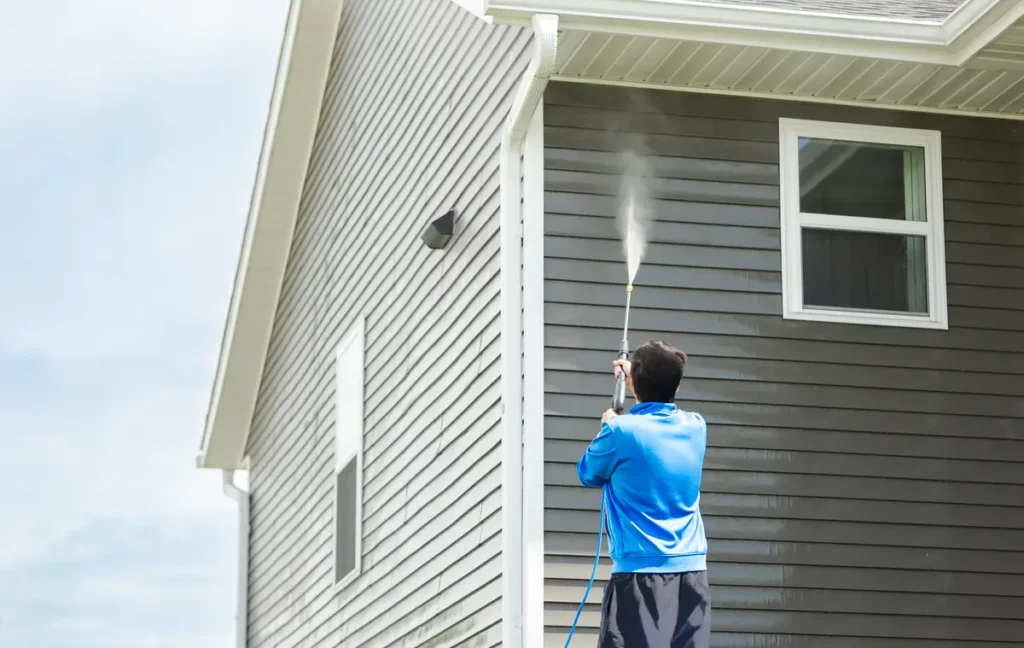 spraying siding