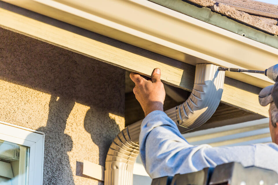 gutter colors-cream colored gutters that match the exterior of house