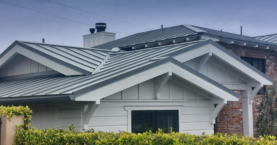 standing seam metal roof-gray standing seam roofing on gray sided house