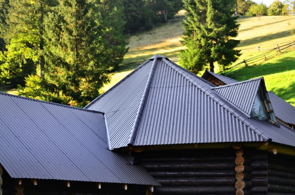 Black metal roof on dark wooden cabin