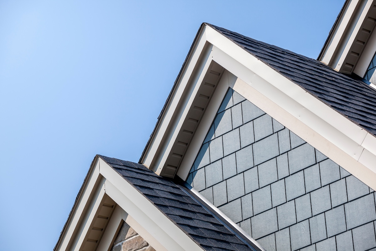 bluish gray siding towards top of house