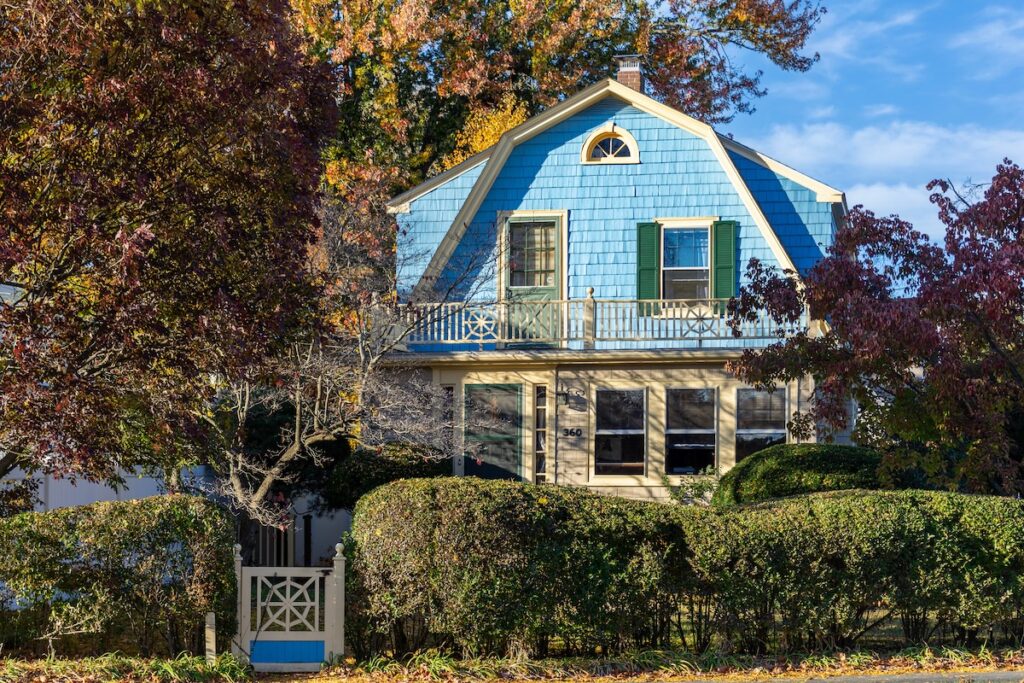 Gambrel roof on blue house