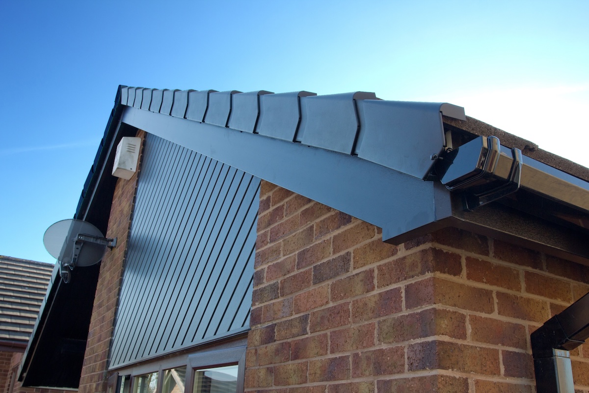 black fascia boards installed on brick house
