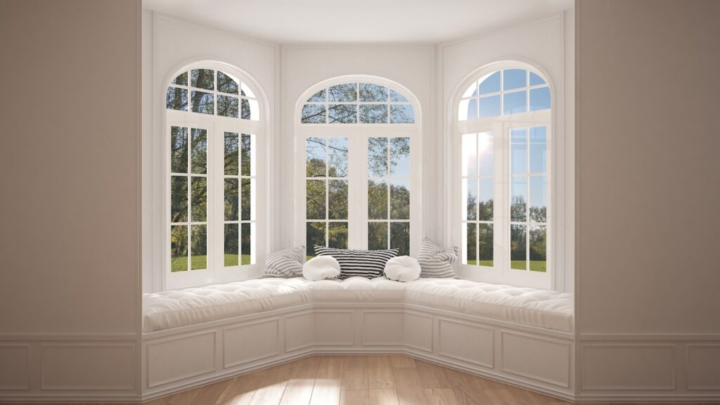 Big bow window with garden meadow panorama