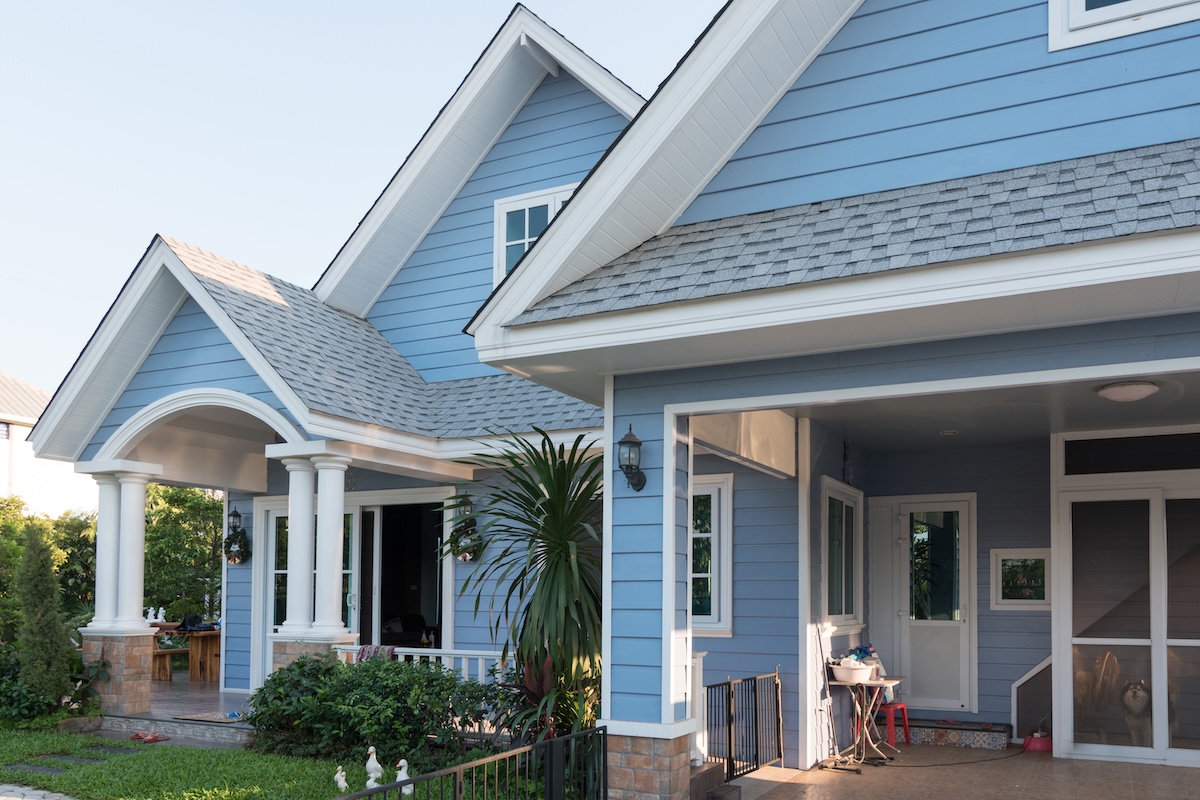 Bright blue house  with landscaping