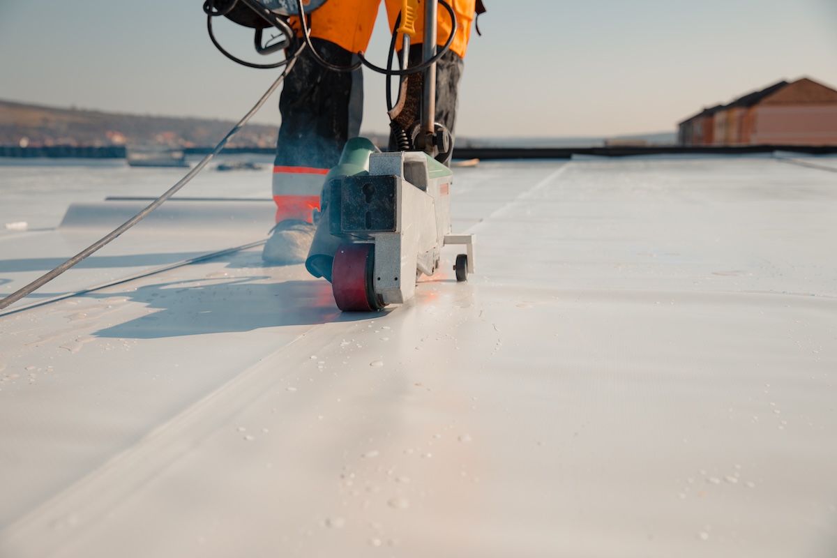 Waterproofing and insulation at construction site, waterproofing membrane preventing water penetration. 