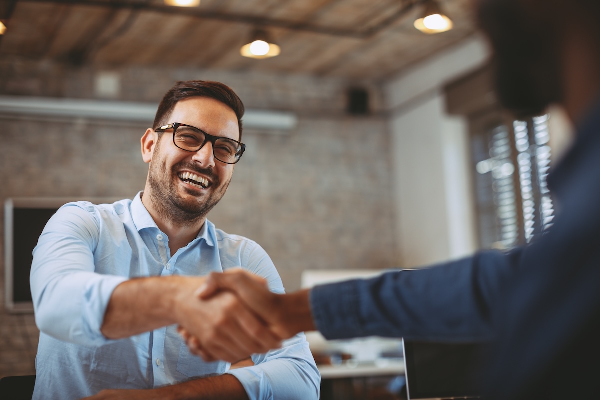 Close up of handshake between business owner and contractor