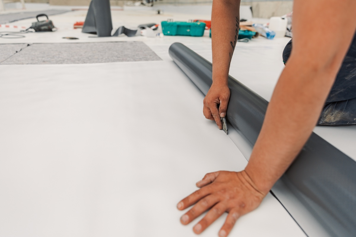 cutting single ply commercial roofing material