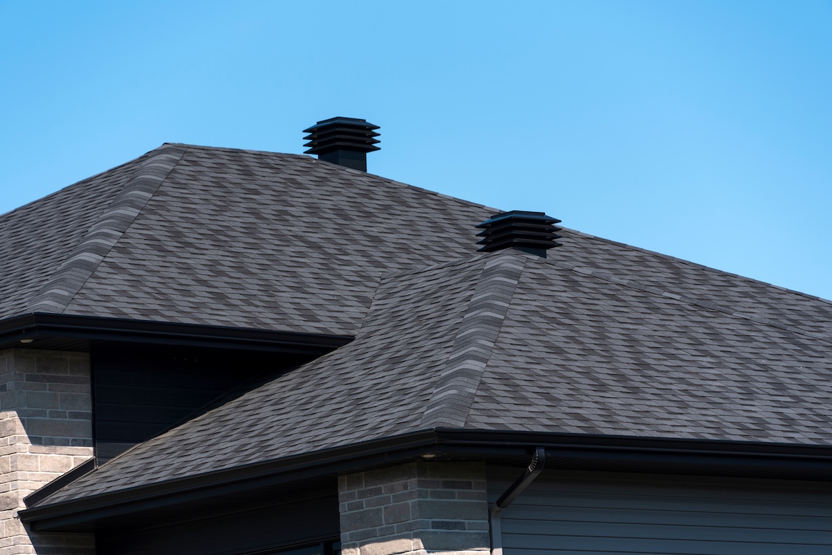 Black asphalt roofing on modern home