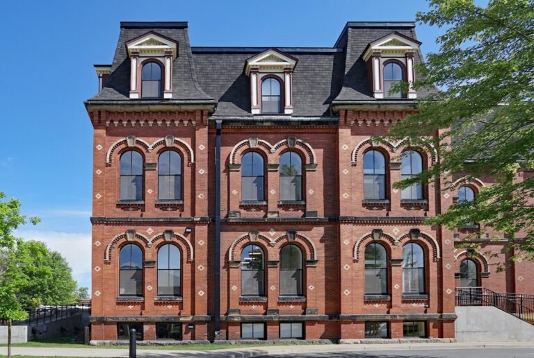 Large brick house with a mansard roof
