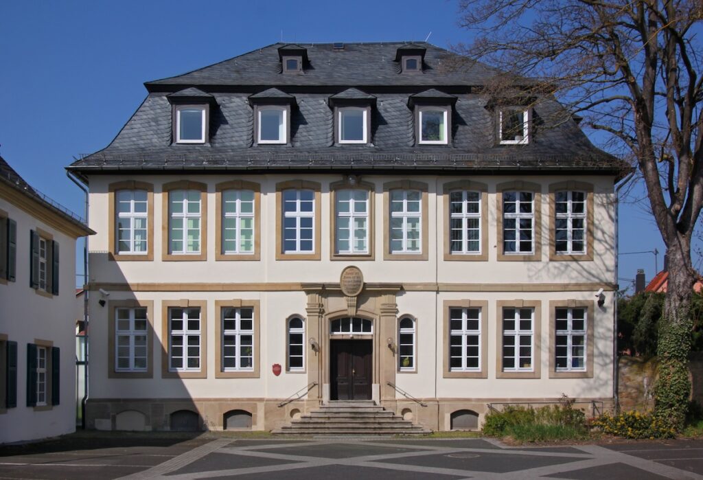 Cream building with mansard roof, school