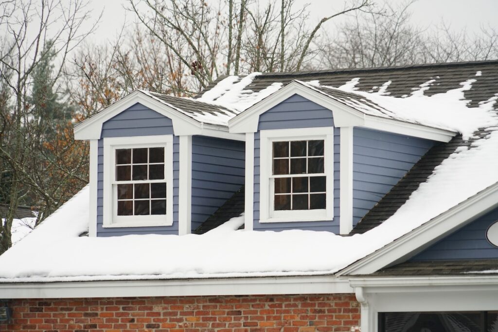 close up on house attic with snow