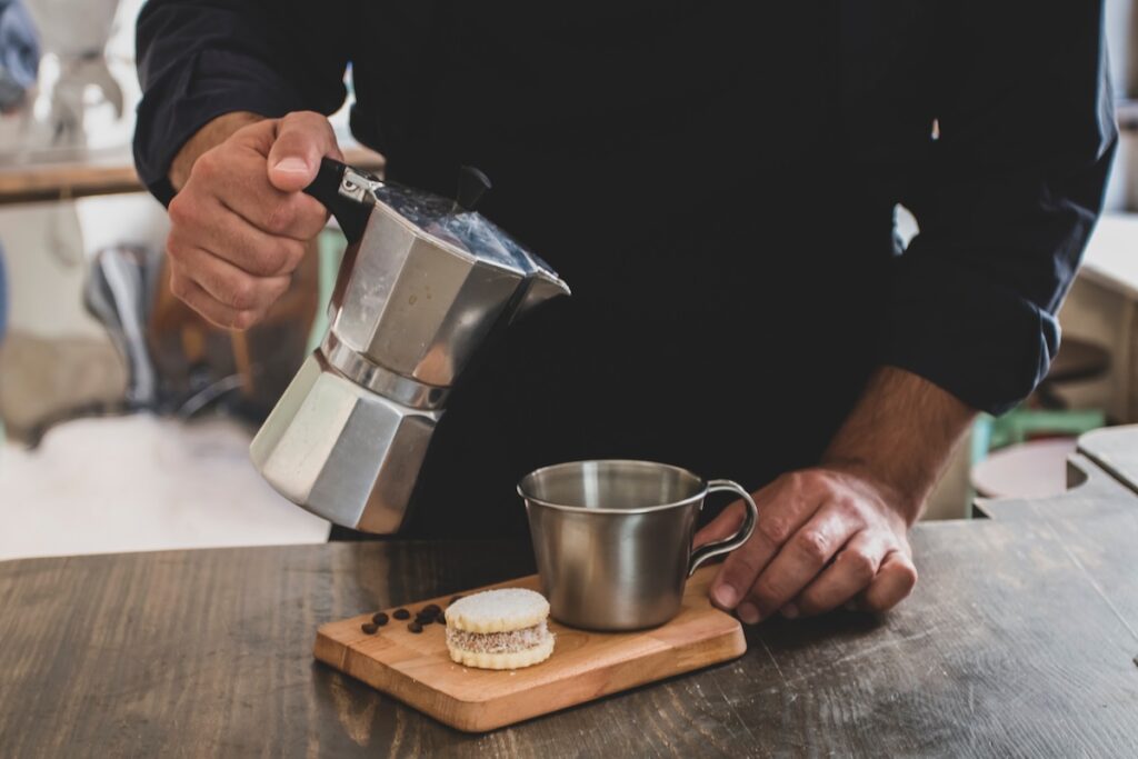 barista pours coffee