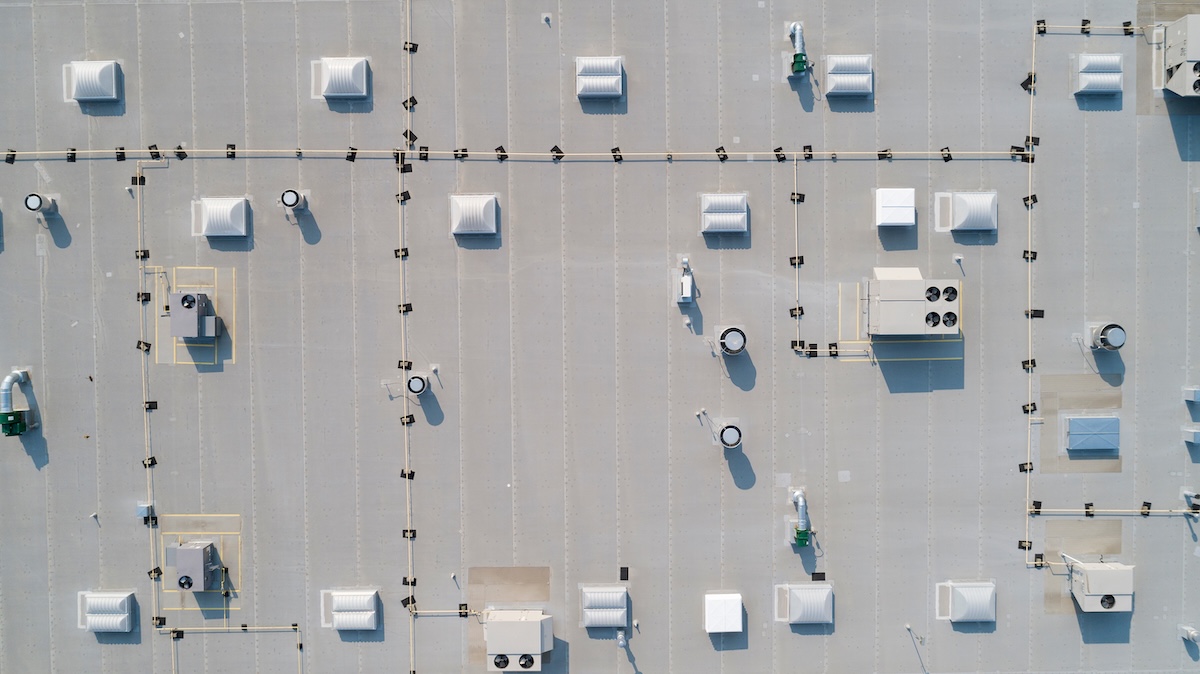 looking down on a commercial rooftop showing skylights and HVAC equipment