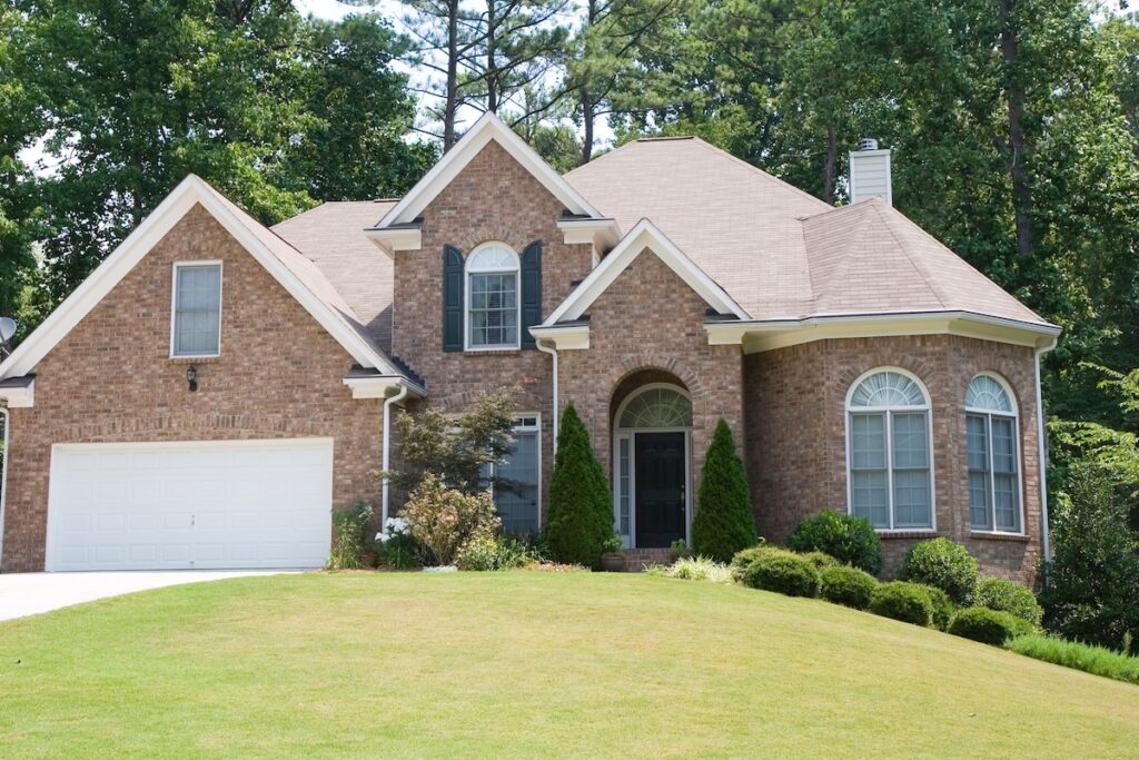 brick house with asphalt roof