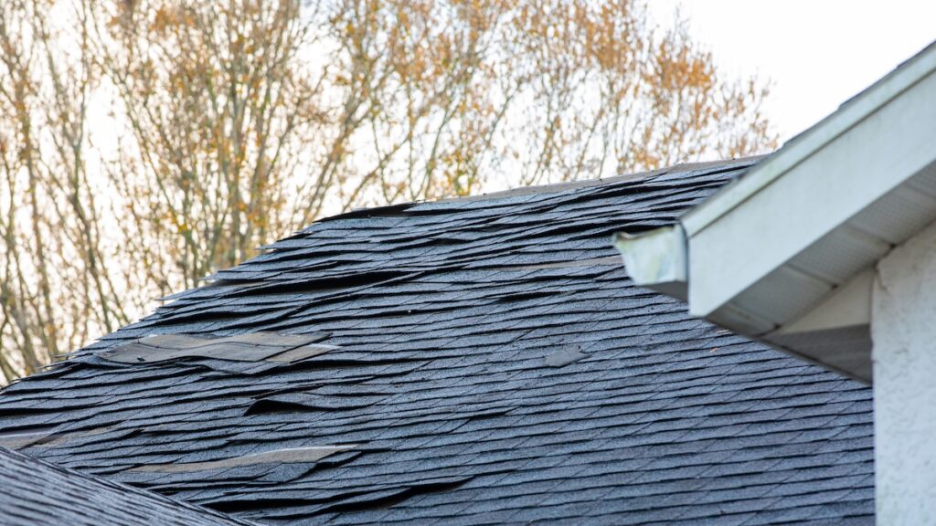 old roof shingle on the roof of house