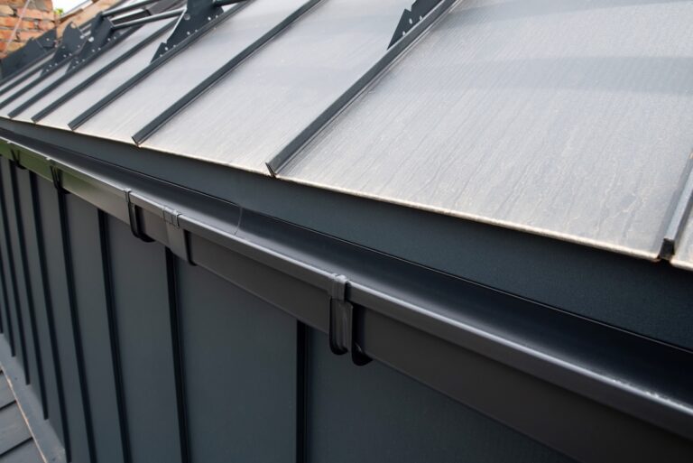 Black gutter system on the seam roof