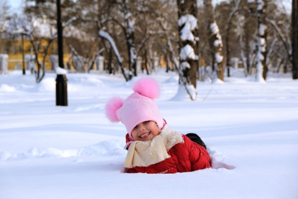 child playing in snow