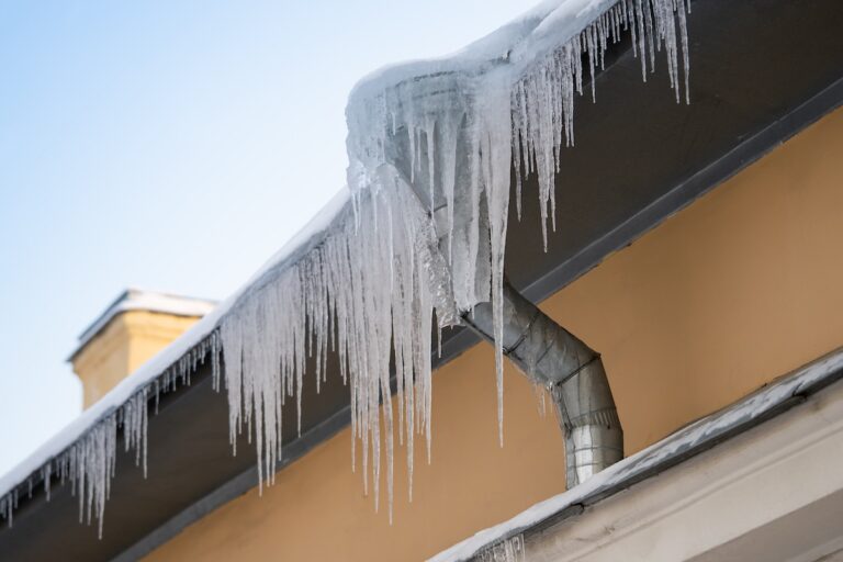 ice dams icicles hanging off of gutters