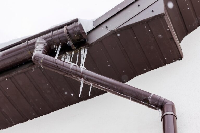 Frozen Ice on Metal Roof and Gutter