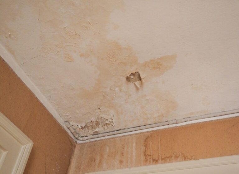 condensation stains on ceiling light brown ruined wall