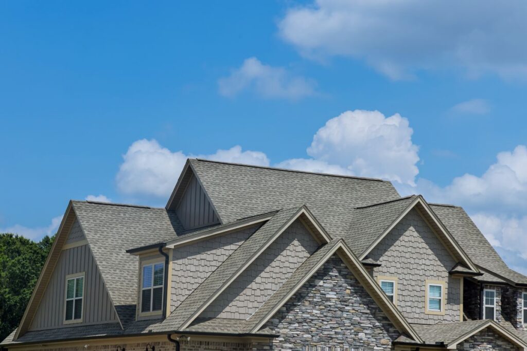 how much does a new roof cost shingles big house cloudy sky