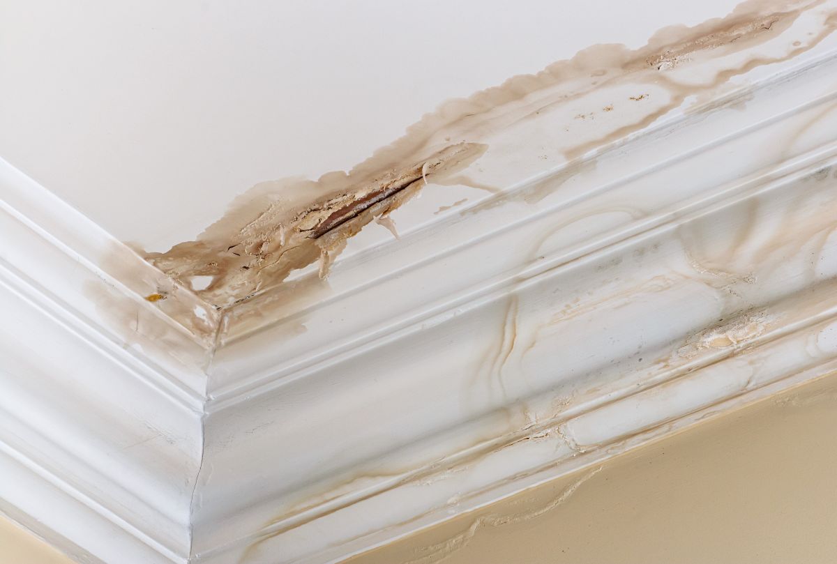 ceiling water damage repair yellow stains on wall