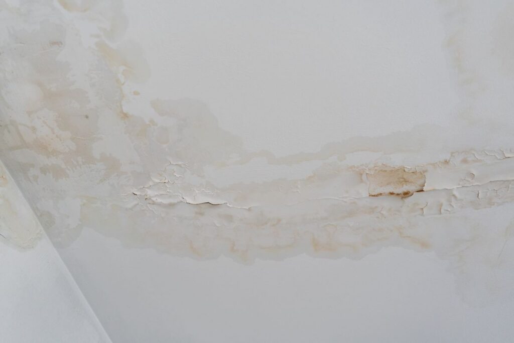 ceiling water damage repair wall cracked and wet