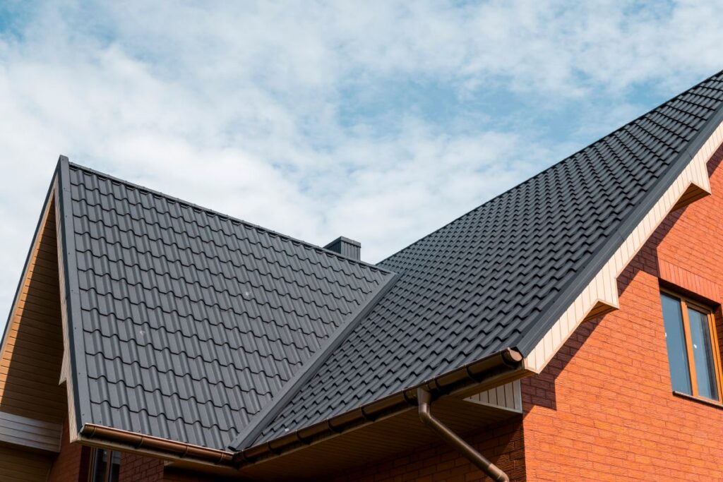 metal roof flashing grey metallic roof orange brick wall
