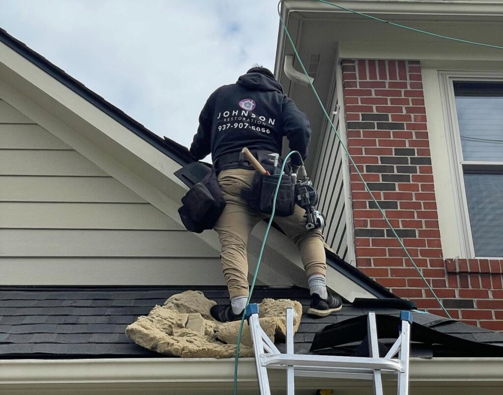 Johnson Restoration team on a roof