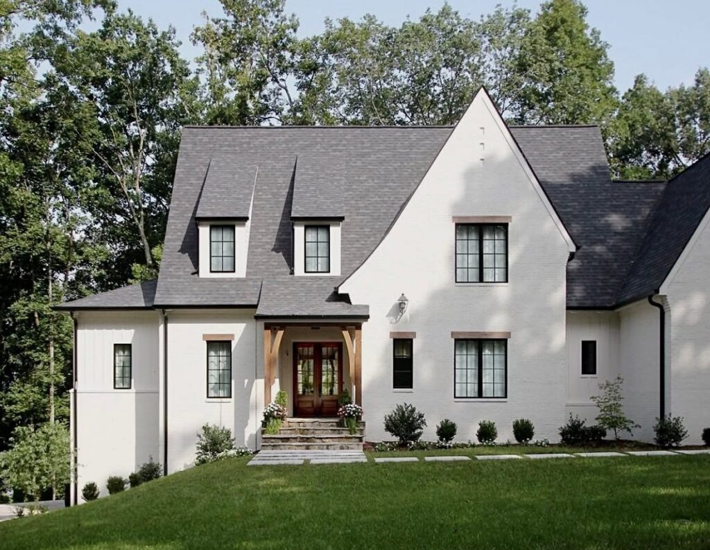 a beautiful house with a shingle roof