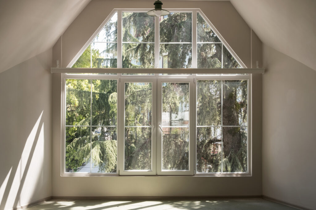 bay window installation sun light through the large white windows in empty interior