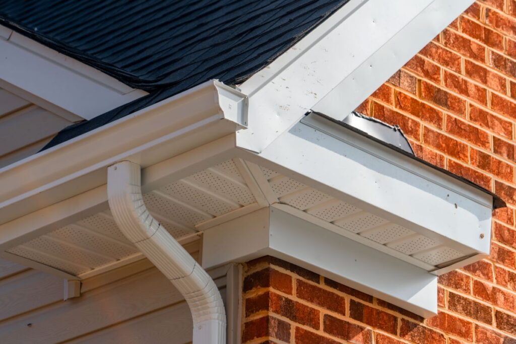 k style vs half round gutters orange bricks white eaves roof