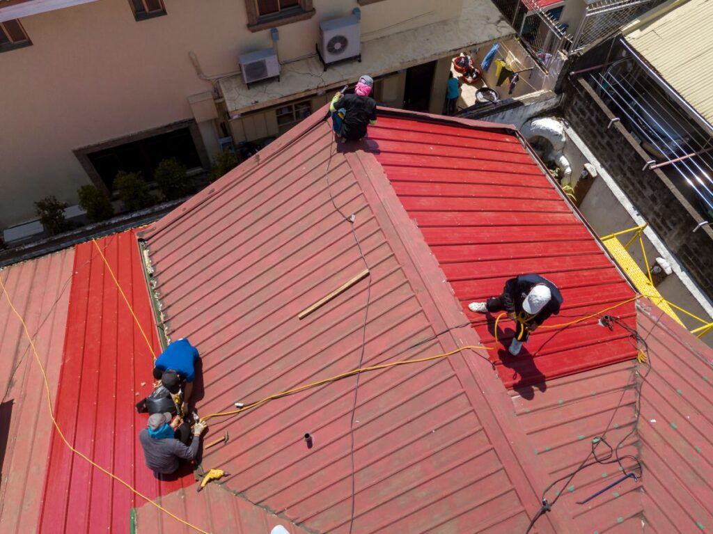 metal roofing mason oh workers repairing red roofw